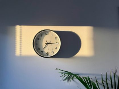 clock on wall at sunset